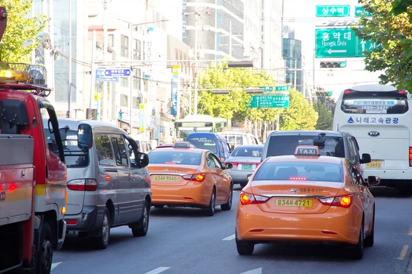Traffic approaching on a busy road through the Gangnam district of South Korea