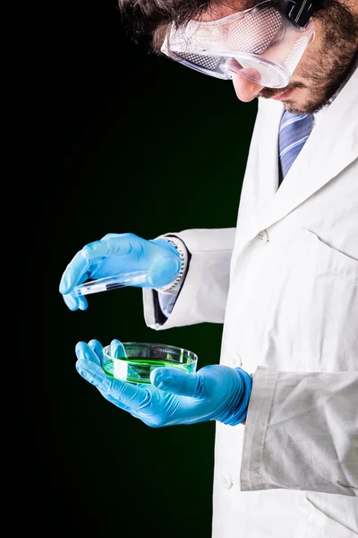 Researcher opening a petri dish