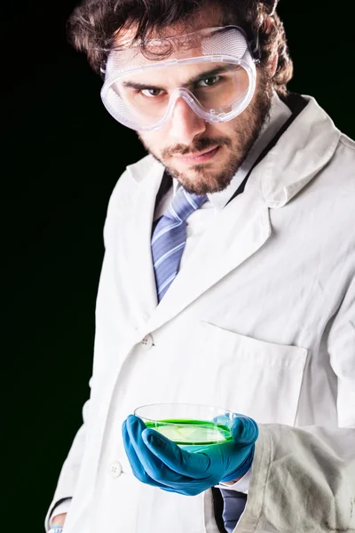Researcher with a petri dish