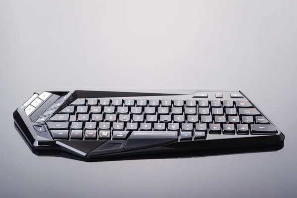 Gaming keyboard on shiny surface