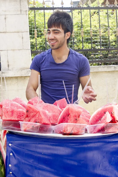 A man sells watermelons on the streets of Istanbul