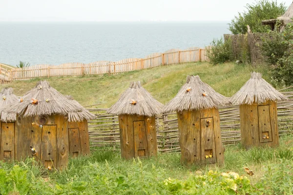 TAMAN, RUSSIA - AUGUST 12: Bee hives in the beekeeper\'s home territory in the ethnographic village Ataman on August 12, 2015 in Taman.