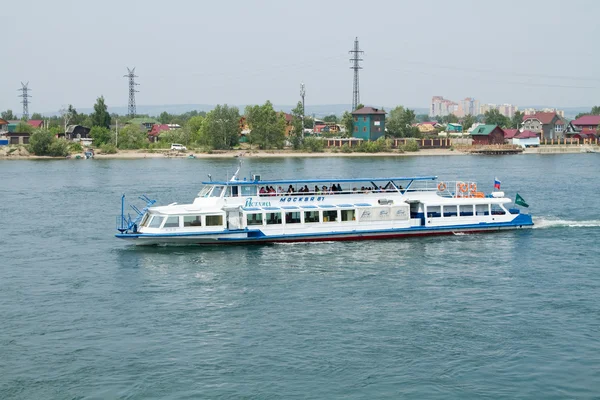 IRKUTSK, RUSSIA - JULY 4: Tourists on excursion boat on the Angara River on July 4, 2015 in Irkutsk.