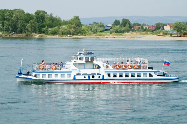 IRKUTSK, RUSSIA - JULY 4: Tourists on excursion boat on the Angara River on July 4, 2015 in Irkutsk.