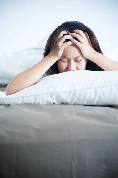 Stress sleepless woman on bed.