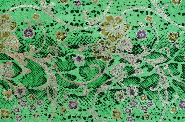 The skin texture, green color patterned