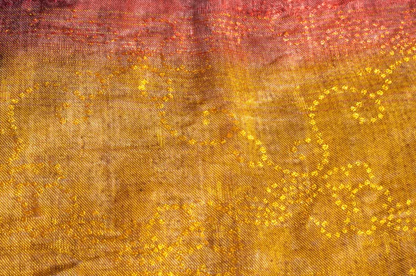 The texture of wool fabric yellow red golden