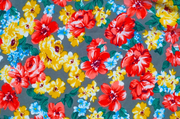 Texture silk cloth. Yellow red flowers painted on cloth
