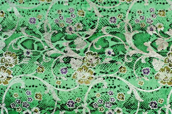 The skin texture, green color patterned