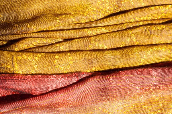 The texture of wool fabric yellow red golden
