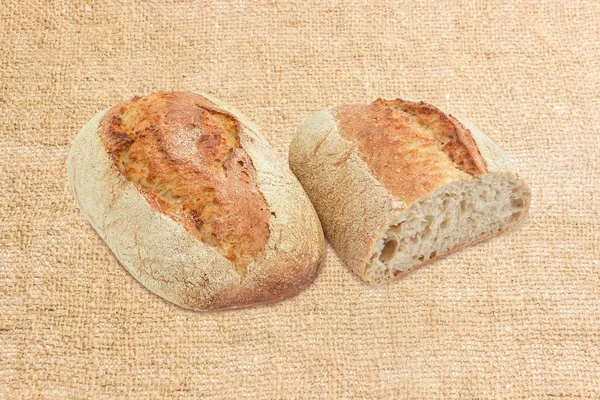 Wheat leavened bread with bran on a ihessian