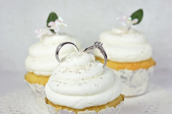 Wedding rings in cupcake icing