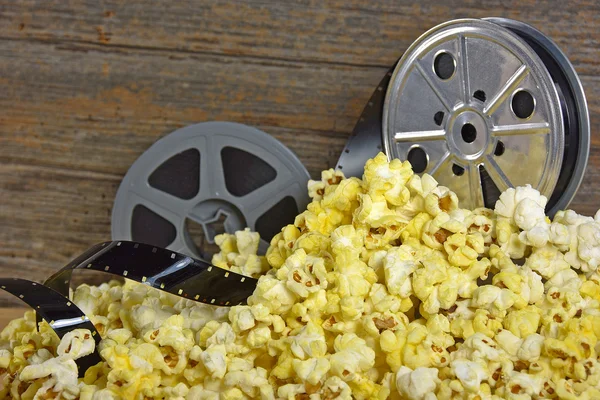 Vintage movie reel and film in popcorn