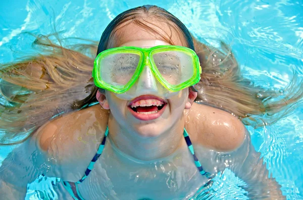 Young girl with braces in pool