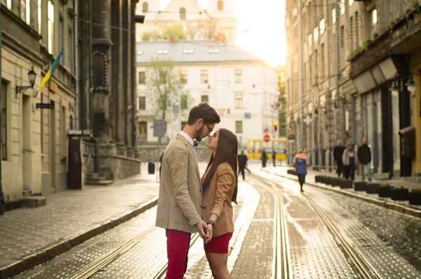 Couple posing on streets of Europe