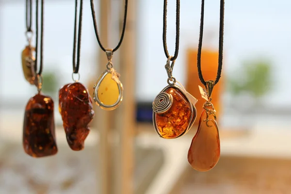 Pendants with amber for sale in Sopot, Poland. Amber is the most Amber is the most popular souvenir from the polish baltic coast.