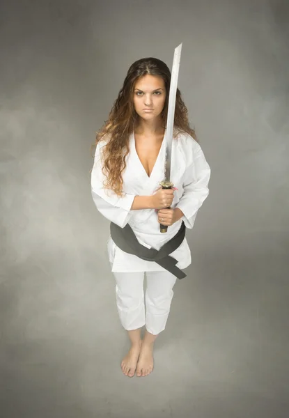 Karate performer with sword on hand