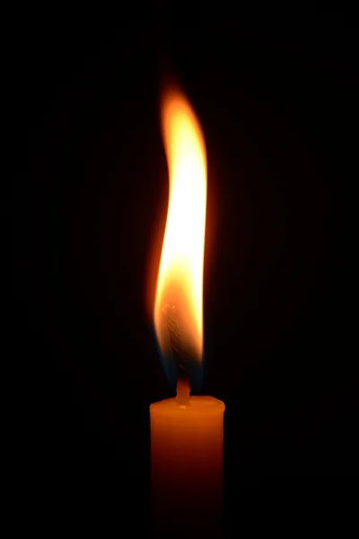 Bright candle in dark background