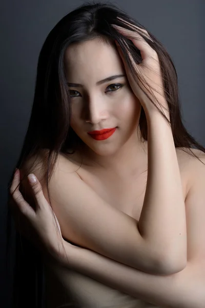 Studio shot of portrait beautiful asian woman with strapless dre