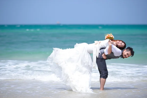 Just married young couple celebrating and have fun at beautiful