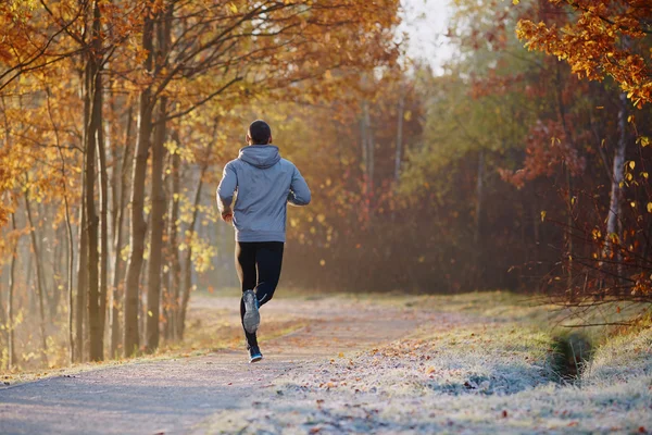 Young man running at park