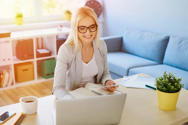 Happy young woman working