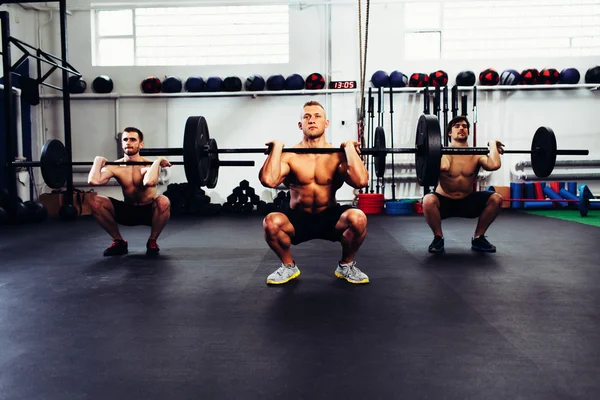 Men at gym training
