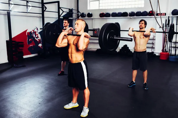 Men at gym training