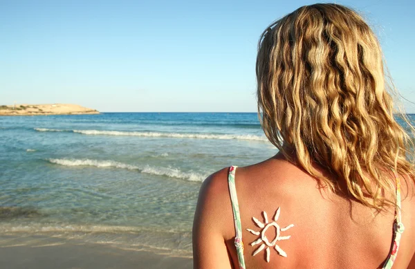 Sun shaped cream on back