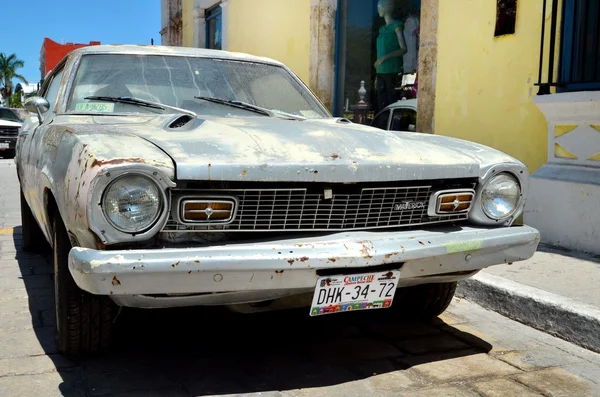 Campeche, Mexico - February 18, 2014: A street in Campeche with damage old Maverick car