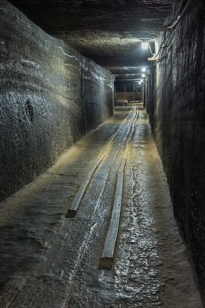 Abandoned cart railway in a salt mine tunnel