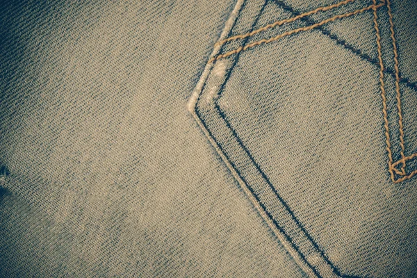 Texture of blue jeans background with filter effect retro vintag