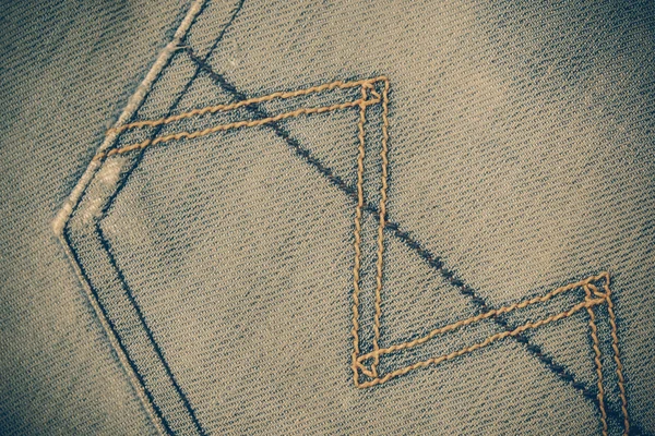 Texture of blue jeans background with filter effect retro vintag