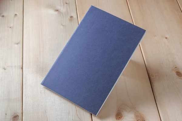 Recycled paper book on wooden background