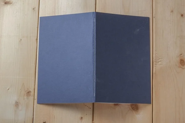 Recycled paper book on wooden background