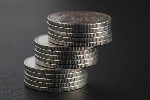 Business finance. save money for investment concept coins on black background