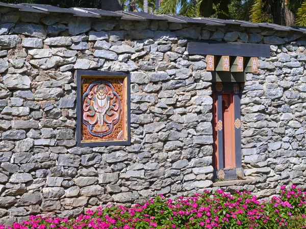 Ancient bhutan style windows on stone walla