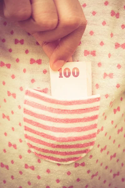 Taking money from  pocket with filter effect retro vintage style