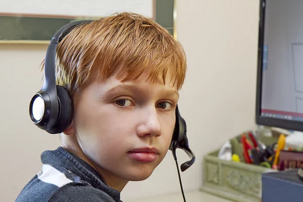 Close-up of Boy Wearing Headset while Playing Video Games