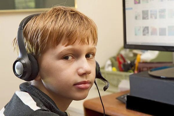 Closeup of Boy wearing Headset playing Video Games