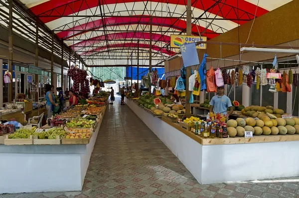 Sellers in indoor vegetable market