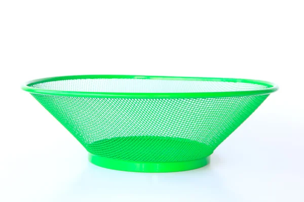 Green basket on a white background - Stock Image