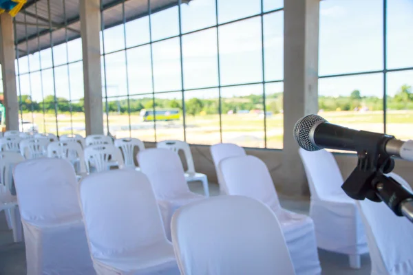 Stock Photo - Close up of microphone in conference room