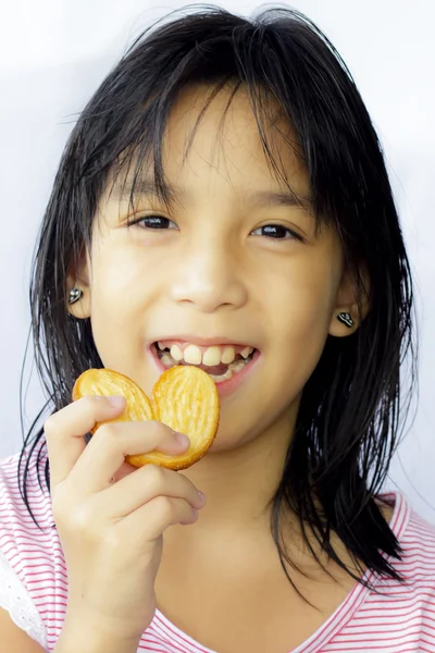 Cute asian girl eating slide bread