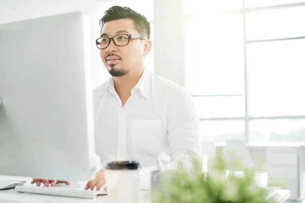 Coder working on script in office