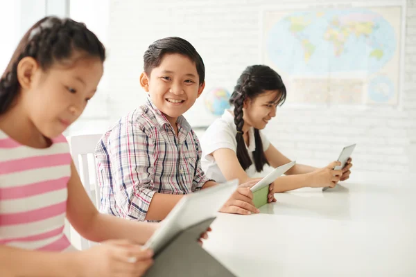 Schoolkids having lesson in class