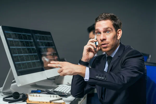 Stock market trader showing a gesture