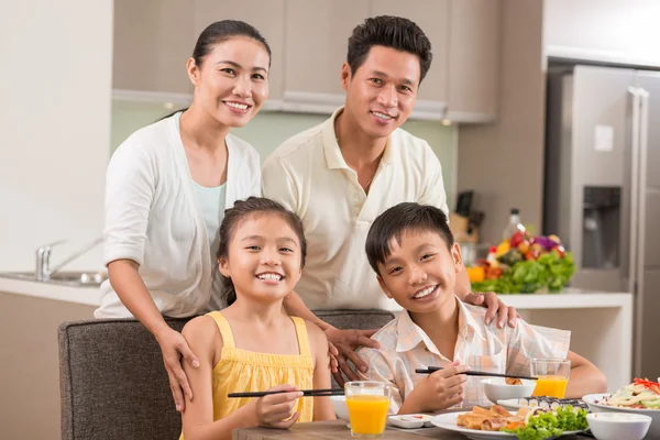 Vietnamese family in dining room