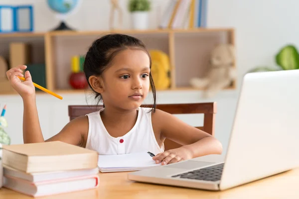 Little Indian girl doing homework