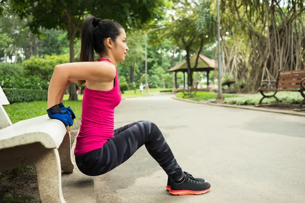 Doing triceps bench dips